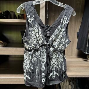 Unique Black and White Sleeveless Top with sequin detail.